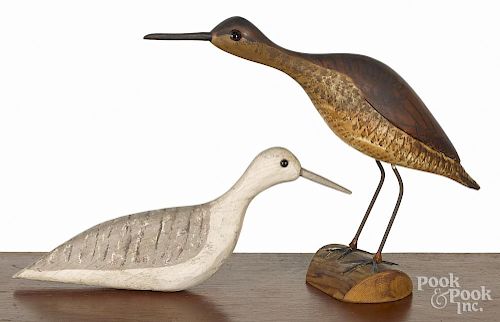 Two carved and painted shorebird decoys, 20th c., one branded WG, the other signed illegibly