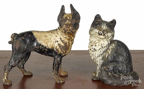 Two cast iron doorstops, early 20th c., to include a seated cat, 9'' h., and a Boston Terrier