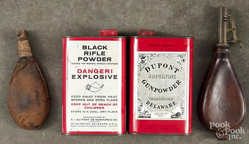 Two leather powder flasks, 19th c., together with two Dupont powder tins, mid 20th c.