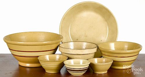 Seven yelloware mixing bowls, largest - 5 3/4'' h., 12 1/2'' dia.