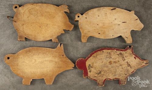 Eight shaped cutting boards, ca. 1900, to include six pigs and two fish