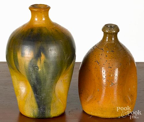 Two redware pinch bottles, 19th/20th c., 8 1/2'' h. and 6 3/4'' h.