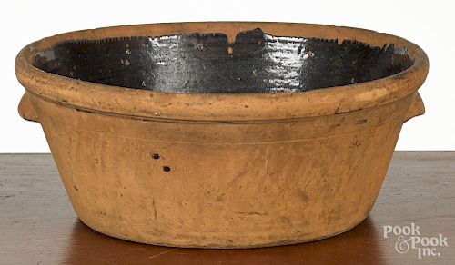 Large Pennsylvania redware bowl, 19th c., 7 1/2'' h., 16'' dia.