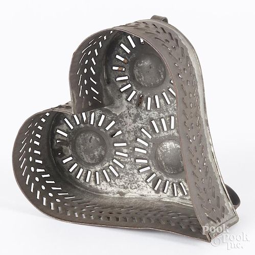 Tin heart-shaped cheese strainer, 19th c., 3'' h., 6'' w., 6'' d.