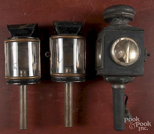 Pair of tin and brass wall sconce lamps, 19th c., 15 1/2'' h., together with a single carriage lamp.