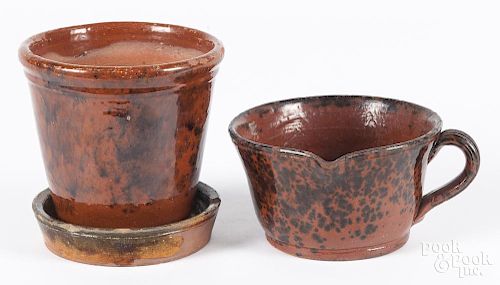 Two pieces of Pennsylvania redware, 19th c., to include a measure with a pour spout, 3 1/4'' h.