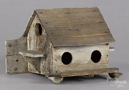 Primitive painted bird house, early 20th c., 12'' h., 20'' w.