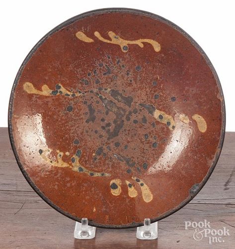 Pennsylvania slip decorated redware plate, 19th c., 8'' dia.