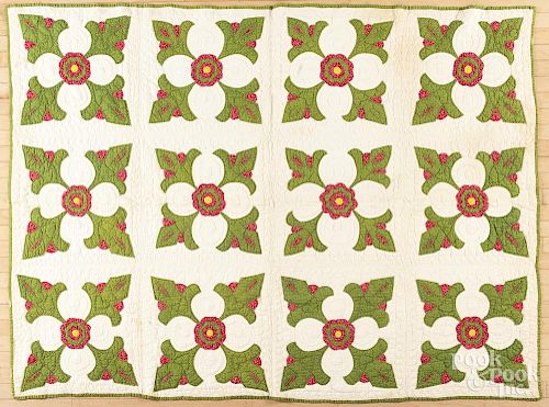 Pennsylvania floral appliqué quilt, late 19th c., with trapunto flower centers, 88'' x 64''.