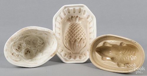 Three earthenware food molds, ca. 1900, to include a rabbit, a pineapple, and a strawberry basket