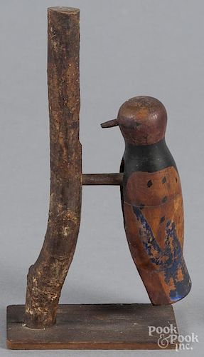 Carved and painted figure of a woodpecker, early 20th c., 7'' h.