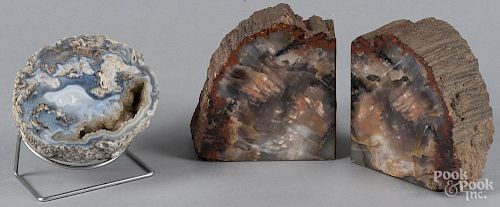 Pair of petrified wood bookends, 7'' h., together with a geode, 6'' dia.