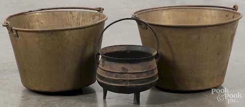 Two brass buckets, late 19th c., tallest - 9'', together with a cast iron gypsy pot, 6'' h.