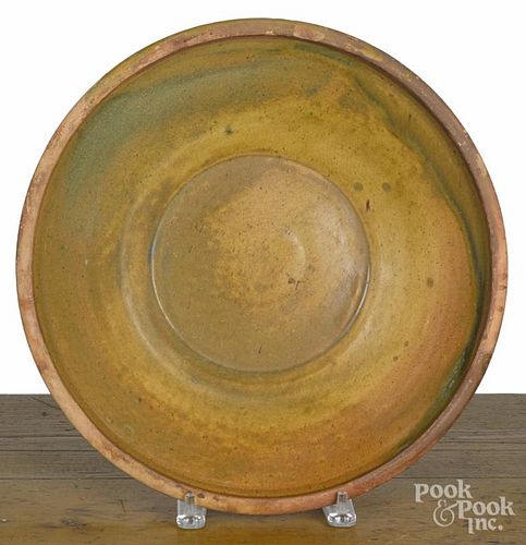Mid-Atlantic redware centerpiece bowl, 19th c., with yellow and green glaze, 13 5/8'' dia.