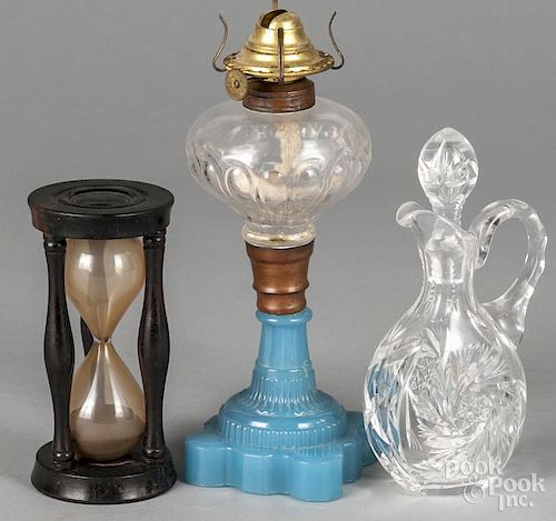 Sandwich glass oil lamp, 19th c., 9'' h., together with a sand timer, 5 1/2'' h.