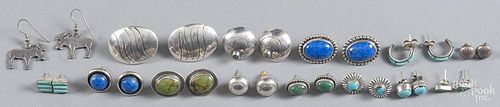 Fourteen pairs of Native American silver and hardstone earrings.