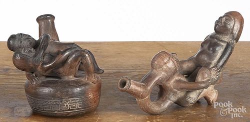 Two Mohican pre-Columbian style erotic-form stirrup vessels, largest - 6 1/4'' h., 7 1/2'' w.