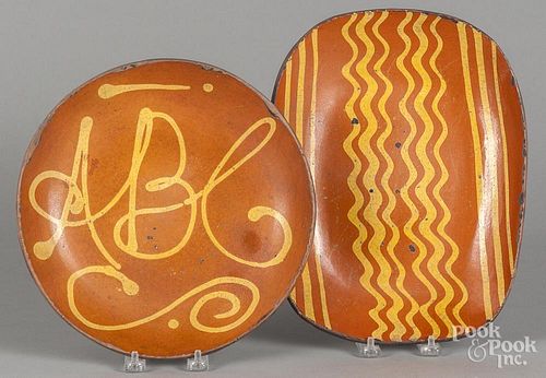 Greg Shooner, redware loaf dish, 9 3/4'' h., 12 1/4'' w., together with an ABC plate, 10 3/4'' dia.