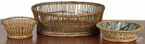 Two sewing baskets, late 19th c., 3'' h. and 3 1/4'' h., together with a fruit basket, 5'' h., 15'' w.
