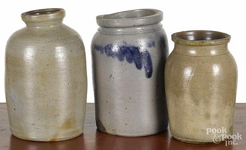 Three Pennsylvania stoneware jars, 19th c., one with cobalt foliate decoration around the shoulder