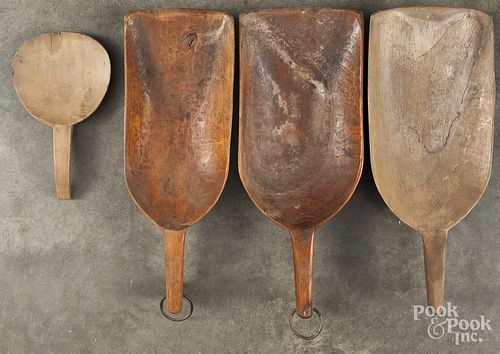 Three wooden scoops, 20th c., largest - 17 1/4'' l., together with a butter paddle.