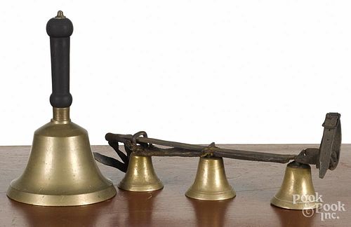 Large brass school bell, 19th c., 11'' h., together with a set of three brass harness bells.