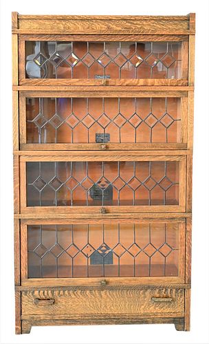 Globe Wernicke Art Mission Oak Stack Bookcase, having four leaded glass doors, plus drawer, height 62 inches, width 34 1/2 inches.