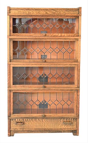 Globe Wernicke Art Mission Oak Stack Bookcase, having four leaded glass doors and drawer, height 62 inches, width 34 1/2 inches.