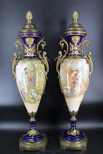 A Pair Of Palace Size Sevres Porcelain Urns.