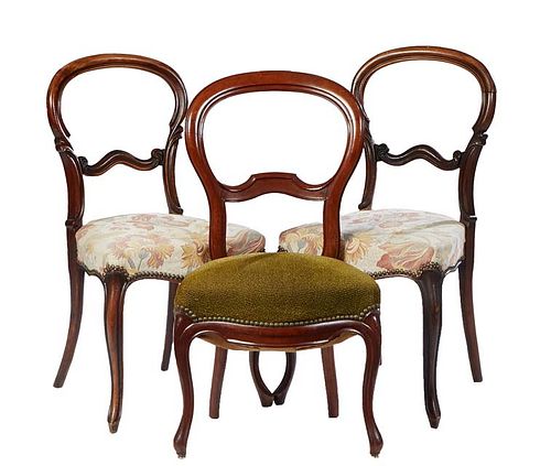 Set of Three Louis Philippe Carved Walnut Ballroom Chairs, 19th c., the arched medallion back with an arched horizontal splat, to a trapezoidal cushio