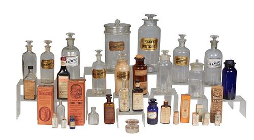 Group of Thirty-Five Apothecary Items, early 20th c., consisting of 7 clear bottles with glass labels; a blue glass bottle with a glass label; a blue 