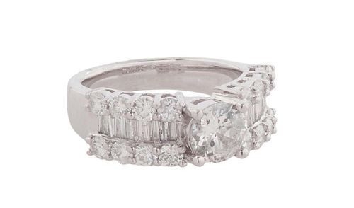 Lady's Platinum Dinner Ring, with a center .97 ct round diamond atop shoulders with central rows of horizontal baguette diamonds flanked by round diam
