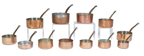 Group of Twelve French Copper Graduated Sauce Pans, 20th c., with iron handles, Largest- H.- 4 1/8 in., W.- 16 1/4 in., D.- 8 in.