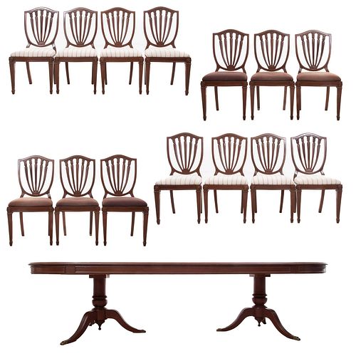 Comedor. SXX. Elaborado en madera enchapada. Decorado con elementos orgánicos, arquitectónicos y molduras. Consta de: mesa y 14 sillas.