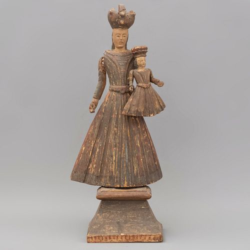 Virgen coronada con niño. SXX. Elaborada en madera. Con base de madera.