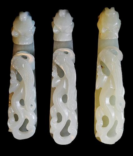 Three finely carved Jade Dragon form buckles - 三个精雕白玉龙纹带扣