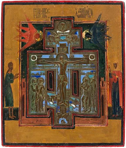A RUSSIAN ICON OF THE CRUCIFIXION WITH A BRASS AND ENAMEL INSERTION, 19TH CENTURY