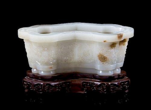 A Pale Celadon Jade Relief Carved Cachepot Width 6 3/8 inches.