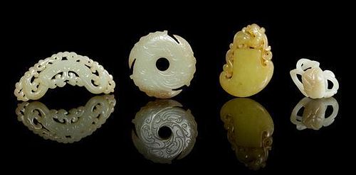 Four Carved Jade Pendants Length of longest 3 1/4 inches.