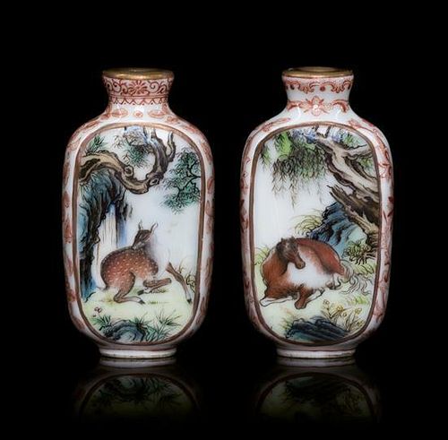 A Pair of Polychrome Enamel Porcelain Snuff Bottles Height of each 2 1/2 inches.