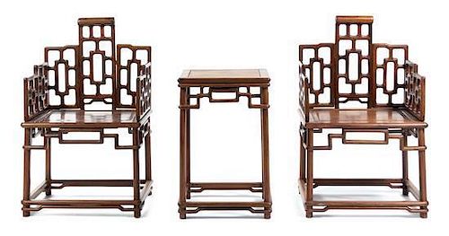 * A Pair of Chinese Huanghuali Chairs and Matching Side Table Height of chairs 39 inches.