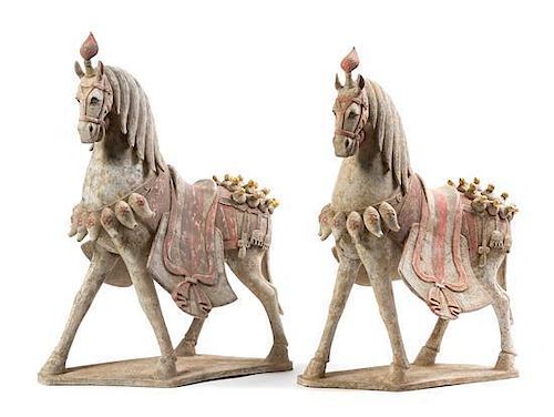 * A Pair of Chinese Painted Pottery Figures of Caparisoned Horses Height 22 inches.