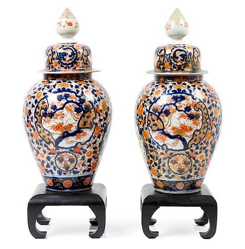 A Pair of Imari Porcelain Jars and Covers Height 17 inches.