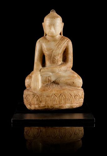 * A Parcel-Gilt White Stone Figure of Buddha Height of figure 11 inches.