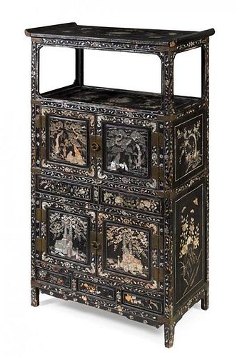 * A Korean Mother-of-Pearl Inlaid Black Lacquered Wood Cabinet Height 47 3/4 x width 29 x depth 15 inches.