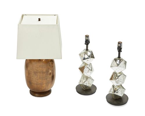 A group of three contemporary table lamps