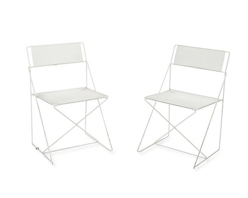 A pair of mid-century modern iron mesh outdoor chairs