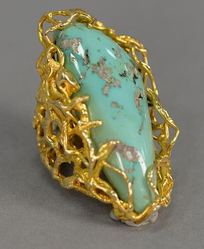 14K gold ring set with large turquoise stone. 
lg. 2 in.; ring size 7