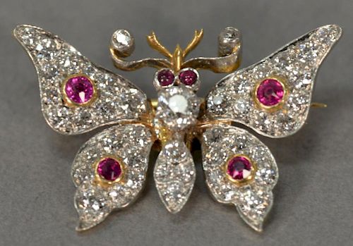 14K gold and platinum butterfly pin, fully set with diamonds and rubies. wd. 1 in.; ht. 3/4 in.