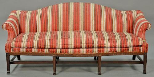 Margolis mahogany Federal style camelback sofa on fluted frame on square tapered and fluted legs joined by stretchers having down cu...